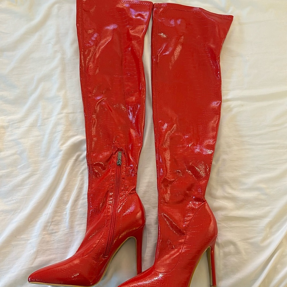 Thigh-high snake skin boot